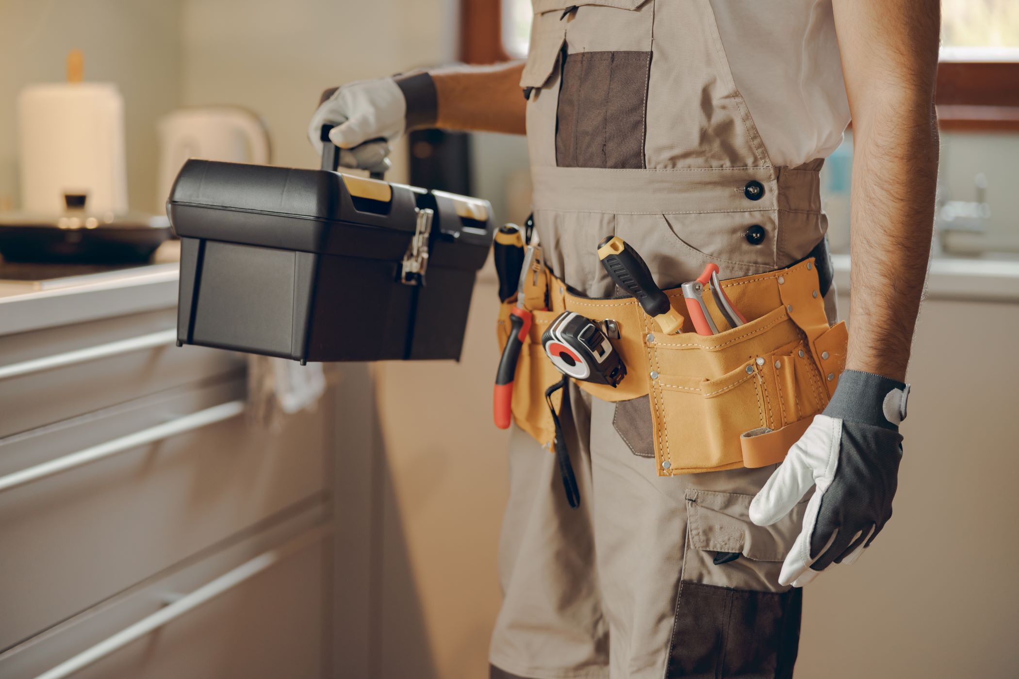 close-up-of-repairman-in-uniform-standing-on-home-2023-12-29-22-19-17-utc.jpg